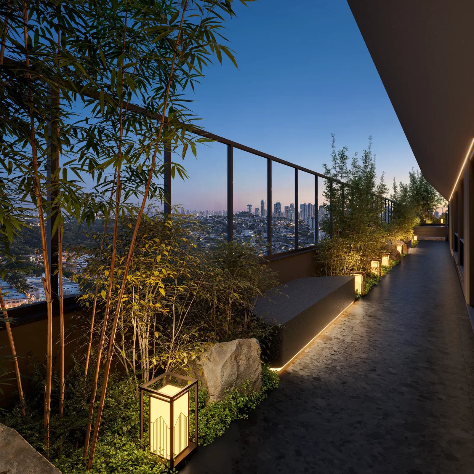 Corredor zen do Ryokan Flamboyant, com rochas e lanternas